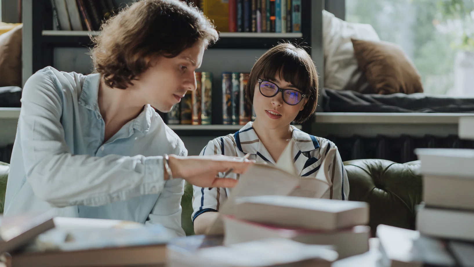 Girl in white school uniform reading book